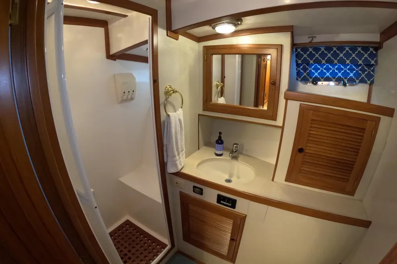 Slide: The Image of Bathroom interior of 1999 Kadey-Krogen 48 North Sea yacht, featuring sink and shower. - 33