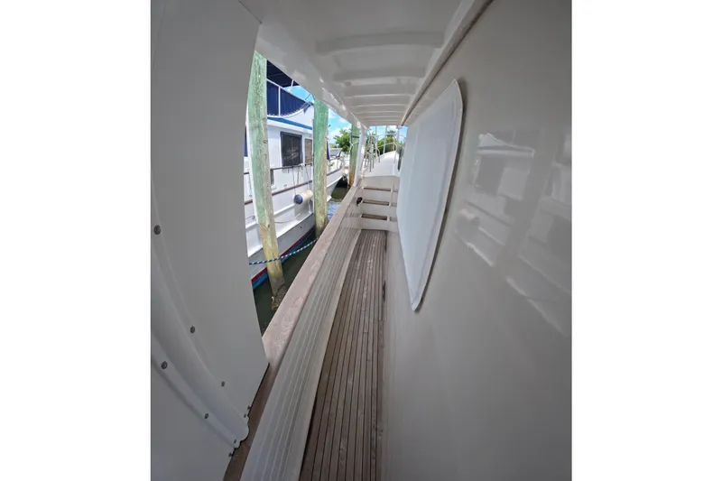 Slide: The Image of Side deck view of 1999 Kadey-Krogen 48 North Sea yacht, docked beside another boat. - 51