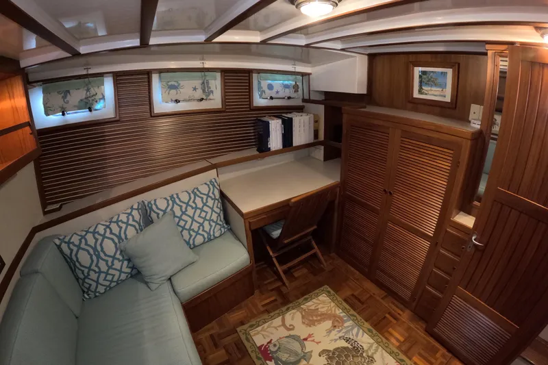 Slide: The Image of Cozy interior of 1999 Kadey-Krogen 48 North Sea yacht with wooden furnishings and seating area. - 37