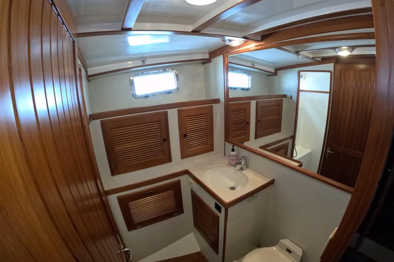 Slide: The Image of Bathroom interior of 1999 Kadey-Krogen 48 North Sea yacht with wooden accents. - 42