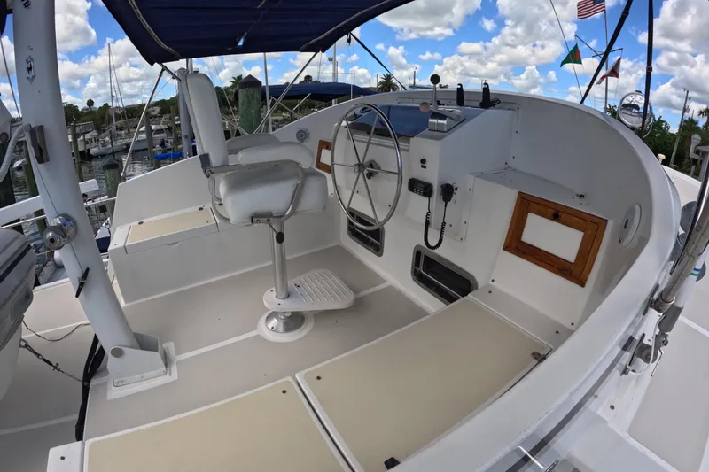 Slide: The Image of Helm of 1999 Kadey-Krogen 48 North Sea yacht with steering wheel and navigation equipment. - 68