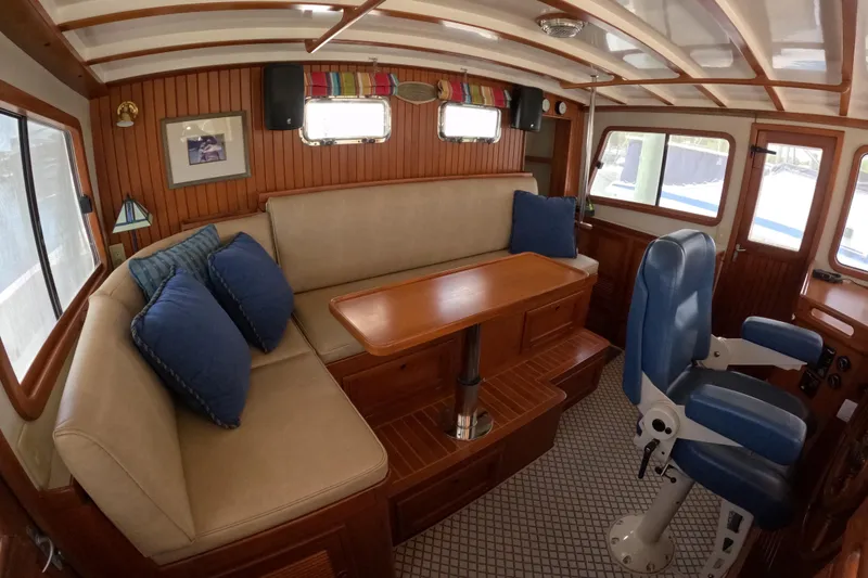 Slide: The Image of Interior of 1999 Kadey-Krogen 48 North Sea yacht with seating and helm chair. - 25
