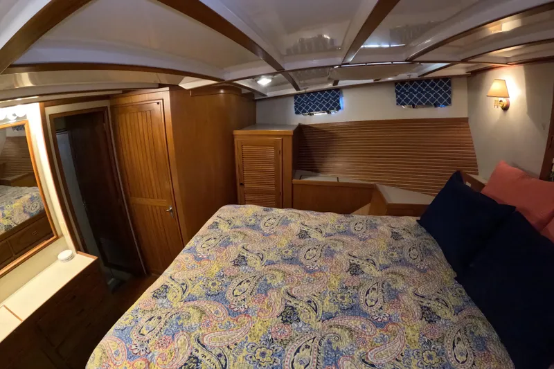 Slide: The Image of Cozy bedroom in 1999 Kadey-Krogen 48 North Sea yacht with patterned bedding and wooden accents. - 31