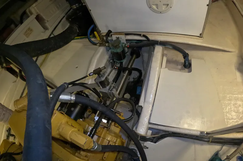 Slide: The Image of Engine compartment of a 1999 Kadey-Krogen 48 North Sea boat, showing mechanical components. - 84