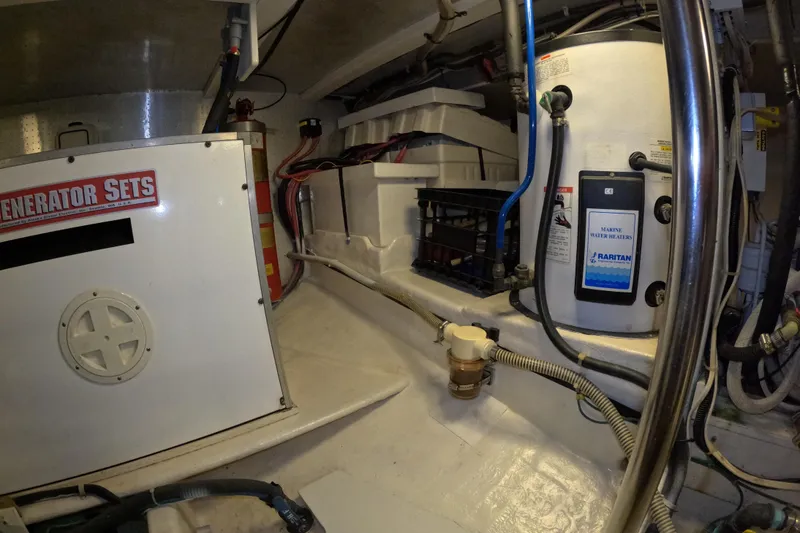 Slide: The Image of Engine room of 1999 Kadey-Krogen 48 North Sea with generator and marine water heater. - 82