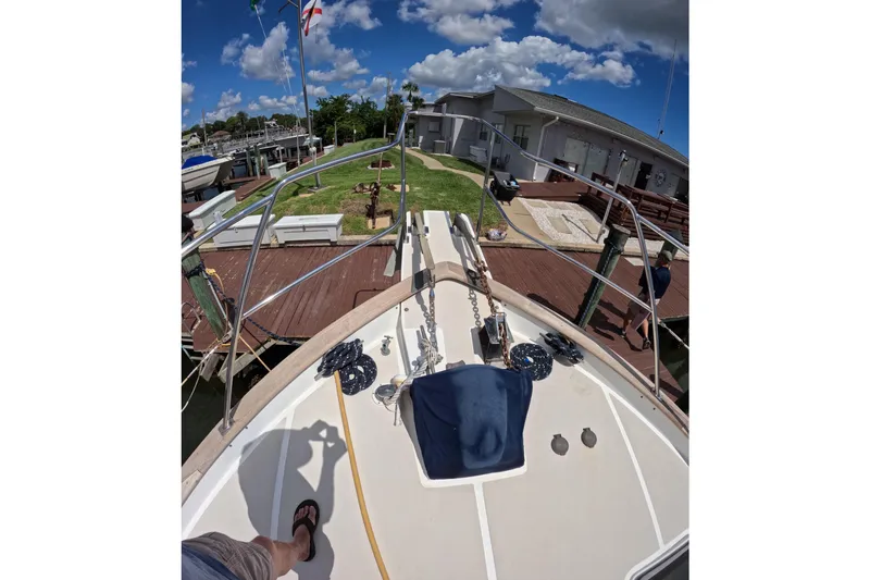 Slide: The Image of Bow view of 1999 Kadey-Krogen 48 North Sea yacht docked at marina. - 57