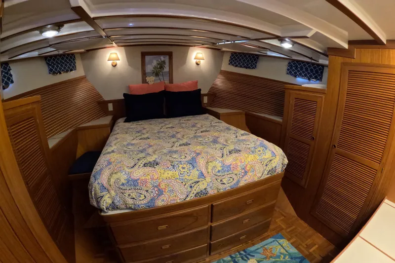 Slide: The Image of Cozy cabin interior of 1999 Kadey-Krogen 48 North Sea with colorful bedding and wooden accents. - 28