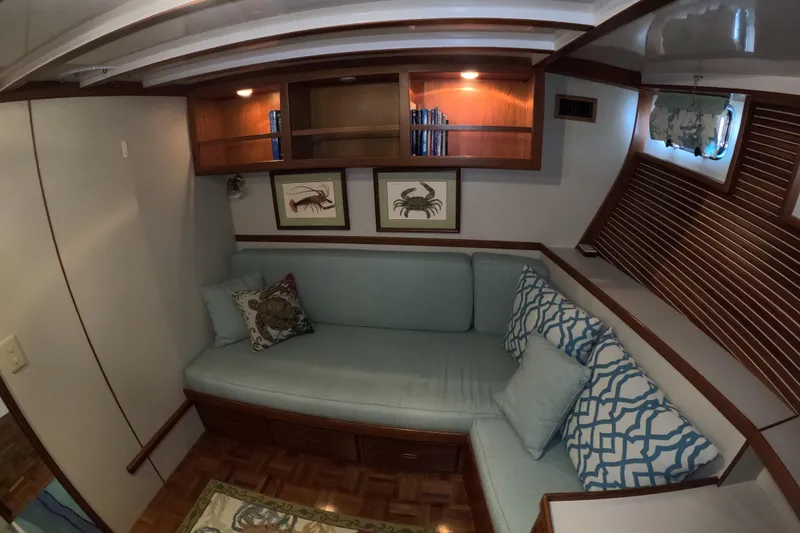 Slide: The Image of Cozy interior of 1999 Kadey-Krogen 48 North Sea yacht with cushioned seating and nautical decor. - 39