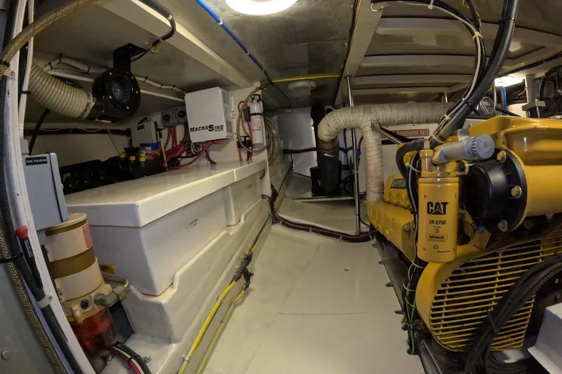Slide: The Image of Engine room of 1999 Kadey-Krogen 48 North Sea yacht, featuring machinery and equipment. - 78