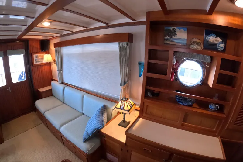 Slide: The Image of Interior of 1999 Kadey-Krogen 48 North Sea yacht with cozy seating and elegant woodwork. - 8