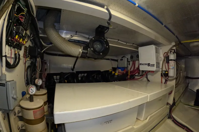 Slide: The Image of Engine room of a 1999 Kadey-Krogen 48 North Sea yacht, showcasing mechanical components. - 85