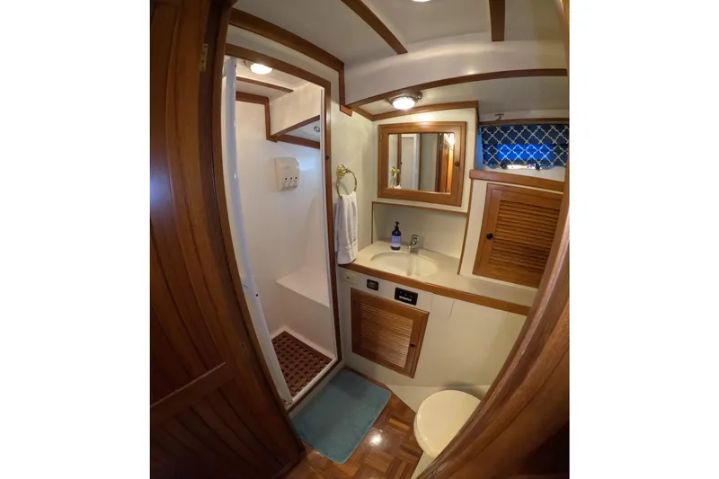 Slide: The Image of Bathroom interior of 1999 Kadey-Krogen 48 North Sea yacht, featuring wood accents and compact design. - 32