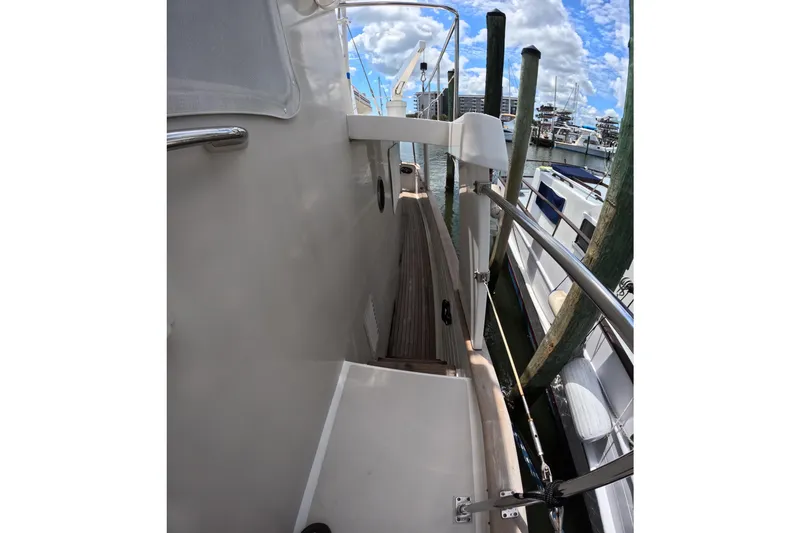 Slide: The Image of Side deck view of 1999 Kadey-Krogen 48 North Sea yacht at marina. - 60