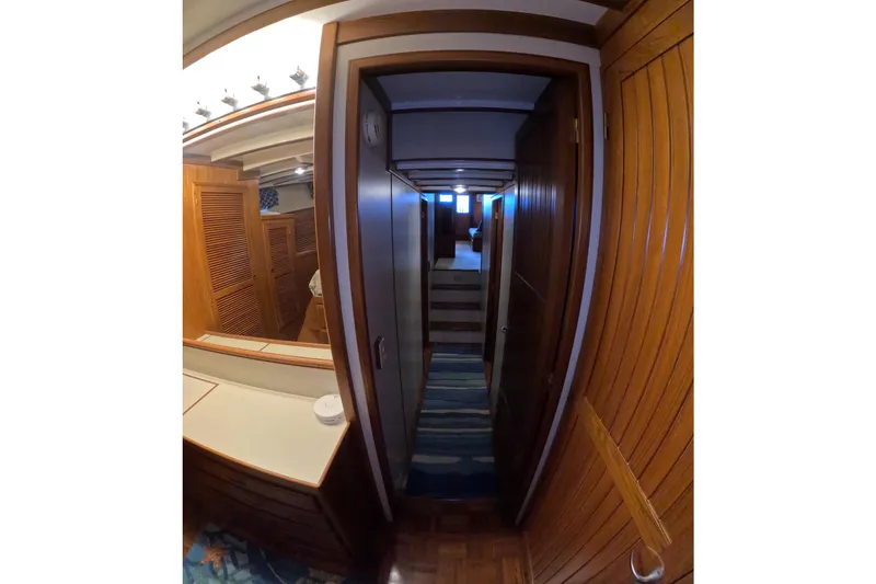 Slide: The Image of Interior hallway of 1999 Kadey-Krogen 48 North Sea yacht with wooden paneling. - 35