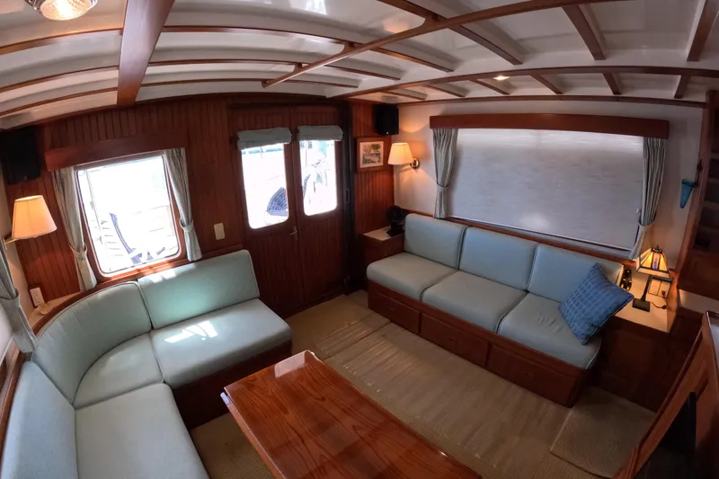 Slide: The Image of Interior of 1999 Kadey-Krogen 48 North Sea yacht with cozy seating and wooden accents. - 10