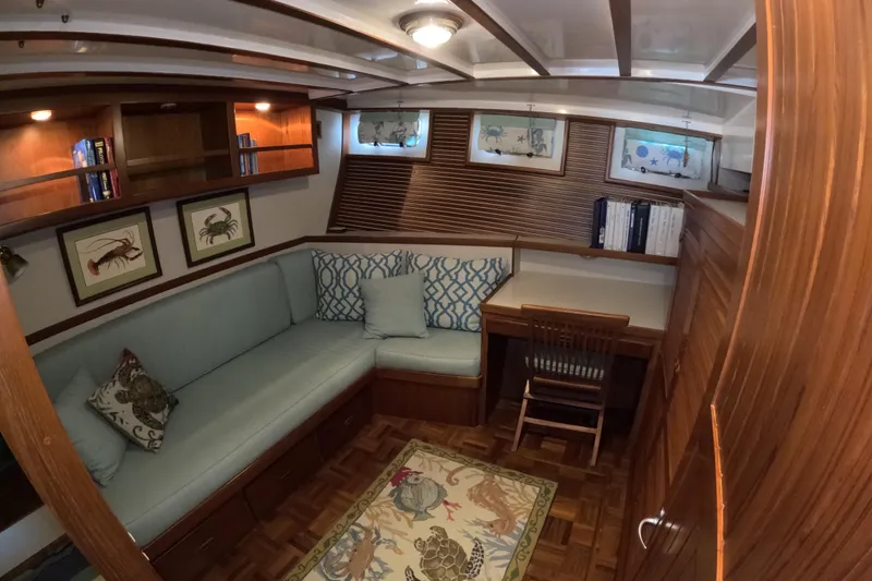 Slide: The Image of Cozy interior of 1999 Kadey-Krogen 48 North Sea yacht with wooden decor and seating area. - 40