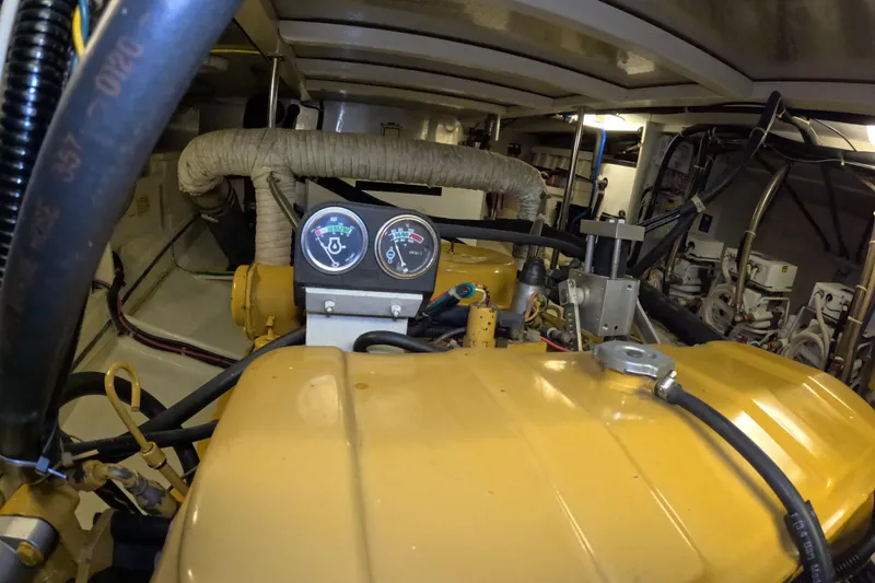 Slide: The Image of Engine room of 1999 Kadey-Krogen 48 North Sea yacht with gauges and machinery. - 95