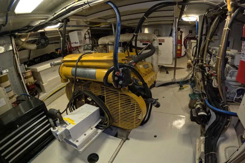 Slide: The Image of Engine room of a 1999 Kadey-Krogen 48 North Sea yacht, showcasing machinery and equipment. - 76