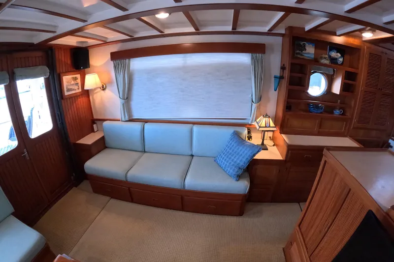 Slide: The Image of Interior of 1999 Kadey-Krogen 48 North Sea yacht with cozy seating and wooden accents. - 7