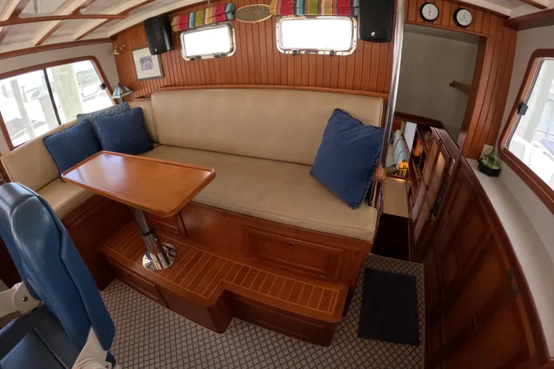 Slide: The Image of Interior of 1999 Kadey-Krogen 48 North Sea yacht with cozy seating and wooden accents. - 23