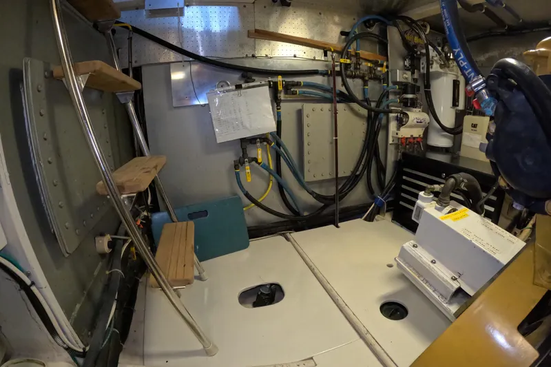 Slide: The Image of Engine room of a 1999 Kadey-Krogen 48 North Sea yacht with equipment and wiring. - 92