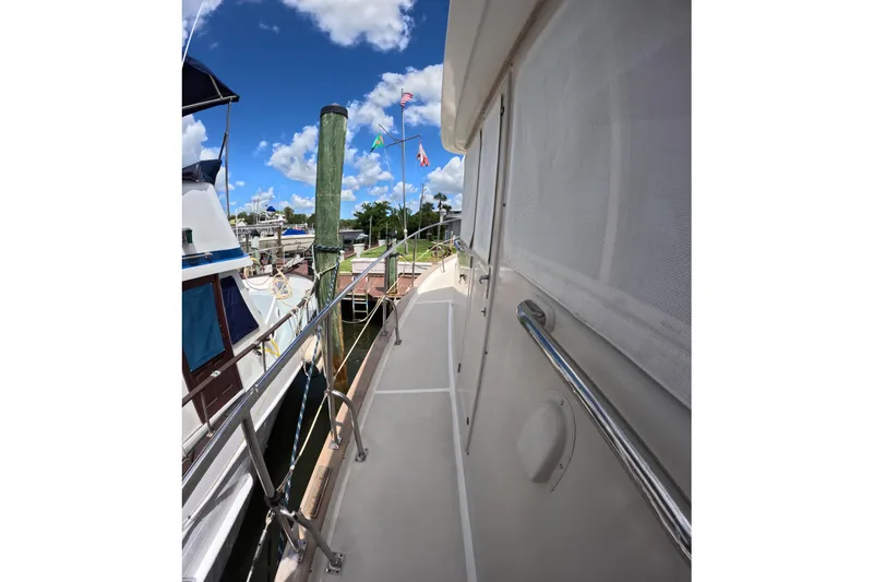 Slide: The Image of Side deck view of 1999 Kadey-Krogen 48 North Sea yacht docked at marina. - 59