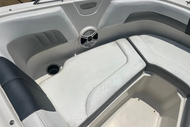 Slide: The Image of Interior seating of a 2020 Chaparral 23 SSi boat with speaker and cup holder. - 7