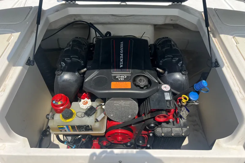 Slide: The Image of Engine compartment of a 2020 Chaparral 23 SSi boat featuring a Volvo Penta 240 V6 engine. - 9