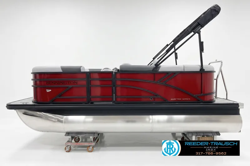 The Image of 2027 Bennington 168 SLJ pontoon boat, red and black design, displayed in a showroom. - 1