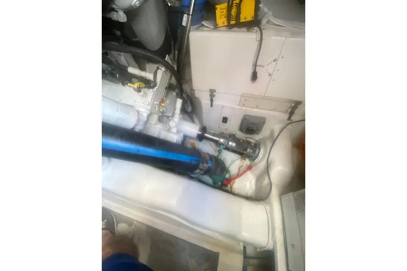 Slide: The Image of Engine room of a 2005 Ocean Yacht 50' Super Sport, showcasing mechanical components and wiring. - 40