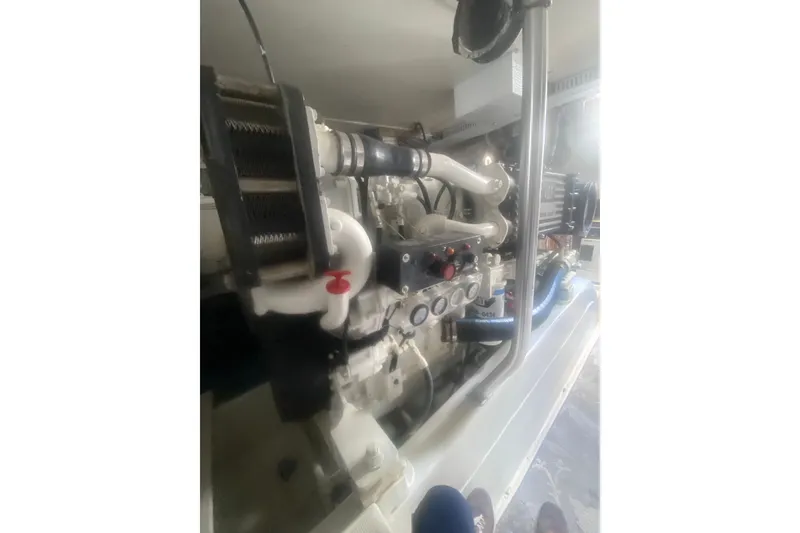 Slide: The Image of Engine compartment of a 2005 Ocean Yacht 50' Super Sport, showcasing mechanical components. - 35