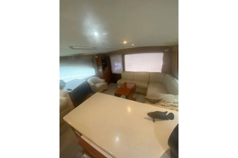 Slide: The Image of Luxurious interior of a 2005 Ocean Yacht 50' Super Sport with elegant seating and modern decor. - 20