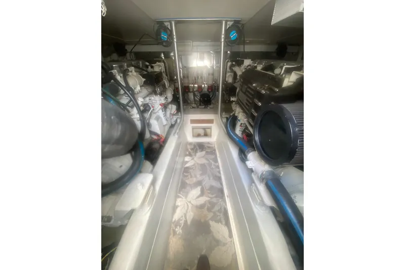 Slide: The Image of Engine room of a 2005 Ocean Yacht 50' Super Sport, showcasing mechanical components. - 33