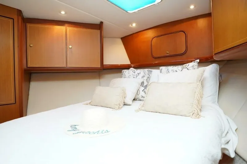 Slide: The Image of Luxurious cabin interior of 2005 Ocean Yachts 50 Super Sport with cozy bedding. - 15