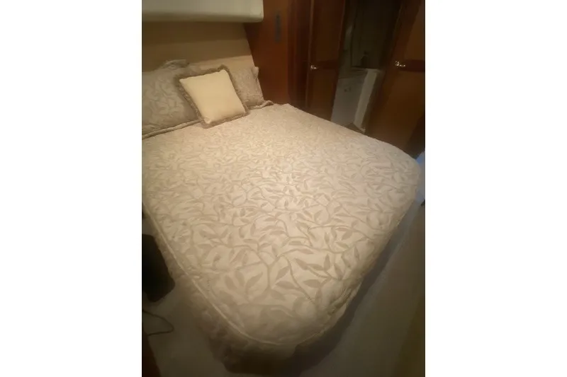 Slide: The Image of Luxurious bedroom interior of 2005 Ocean Yacht 50' Super Sport with elegant bedding. - 13