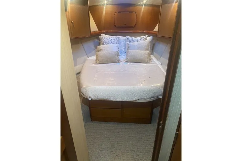 Slide: The Image of Luxurious bedroom interior of 2005 Ocean Yacht 50' Super Sport with elegant bedding. - 16