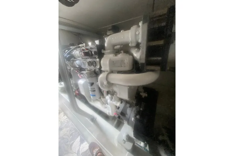 Slide: The Image of Engine compartment of a 2005 Ocean Yacht 50' Super Sport, showcasing mechanical components. - 34