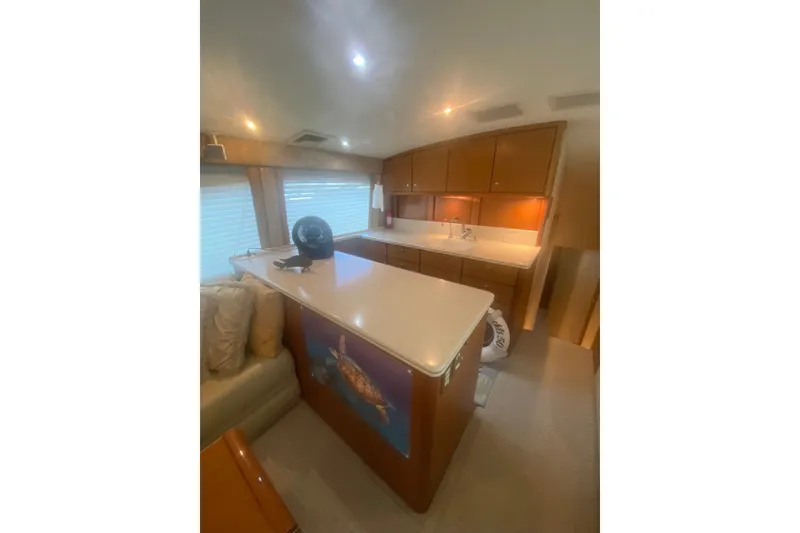 Slide: The Image of Interior of 2005 Ocean Yacht 50' Super Sport with modern kitchen and seating area. - 23