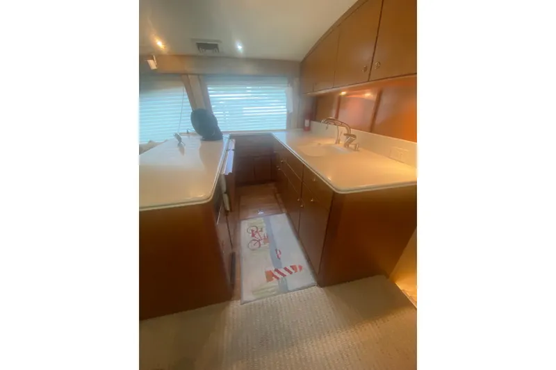 Slide: The Image of Interior of 2005 Ocean Yacht 50' Super Sport, featuring a modern kitchen area. - 18