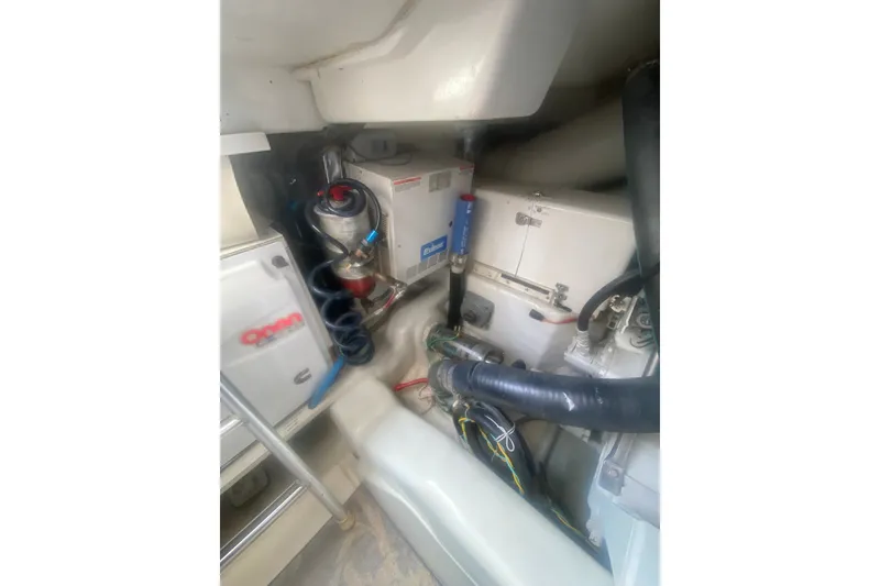 Slide: The Image of Engine room of a 2005 Ocean Yacht 50' Super Sport, showcasing mechanical components. - 38