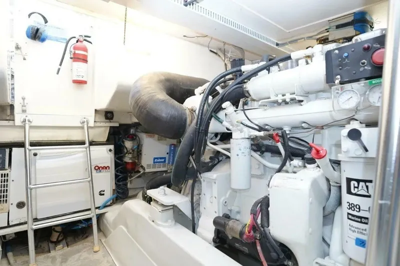 Slide: The Image of Engine room of a 2005 Ocean Yachts 50 Super Sport, featuring CAT machinery and equipment. - 41