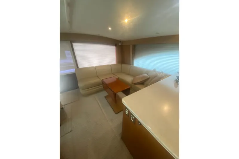 Slide: The Image of Luxurious interior of a 2005 Ocean Yacht 50' Super Sport with plush seating and elegant decor. - 22
