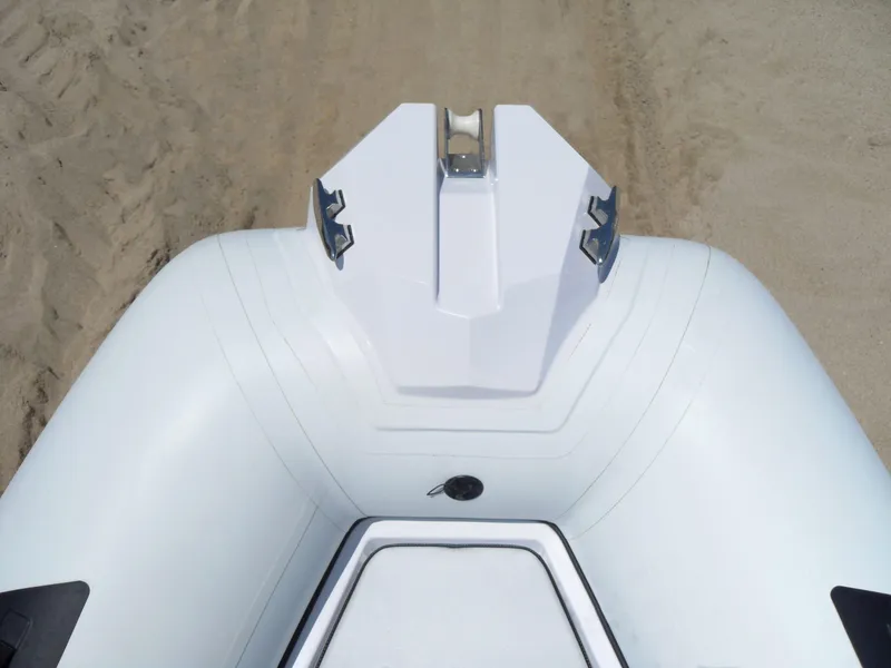 Slide: The Image of Top view of 2025 Ranieri CAYMAN 19 Sport inflatable boat on sandy beach. - 11