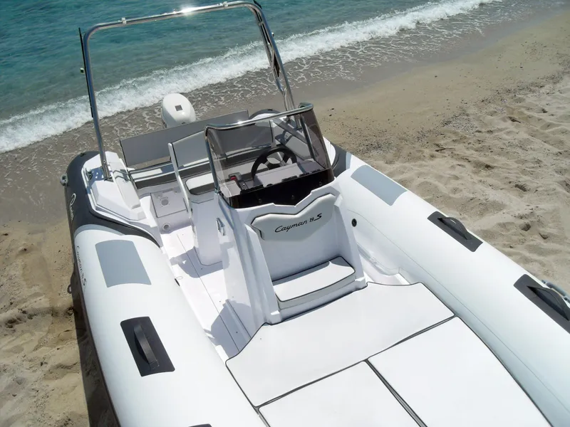 Slide: The Image of 2025 Ranieri CAYMAN 19 Sport inflatable boat on sandy beach. - 12