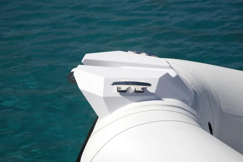 Slide: The Image of Ranieri CAYMAN 19 Sport 2025 boat bow on clear blue water. - 14