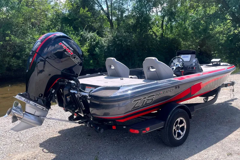 Slide: The Image of A 2024 Nitro Z18 boat with a powerful outboard motor, parked on a trailer. - 5