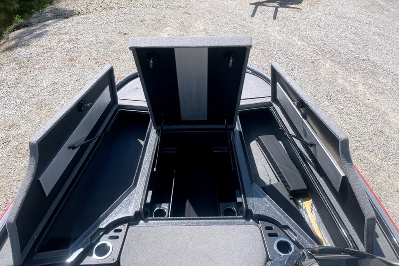 Slide: The Image of 2024 Nitro Z18 boat storage compartments open, showcasing spacious interior design. - 9