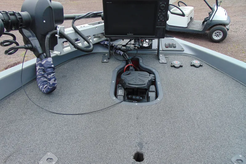Slide: The Image of Deck of a 2010 Boomeranger 188 boat with navigation equipment and controls. - 19
