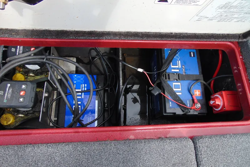 Slide: The Image of Battery compartment of a 2010 Boomeranger 188 with cables and switches visible. - 9