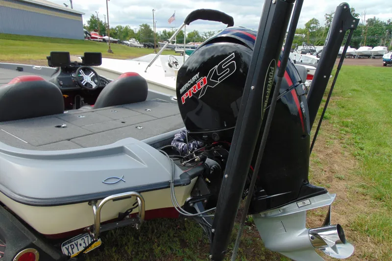 Slide: The Image of Boomeranger 188 boat with Mercury Pro XS engine, 2010 model, parked on grass. - 3